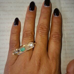ring featuring raw emerald and quartz, set in a gold-plated band.